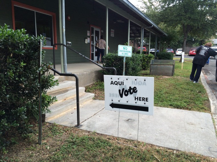 Signs show direction to the location in Leon Valley, Texas for early voting.