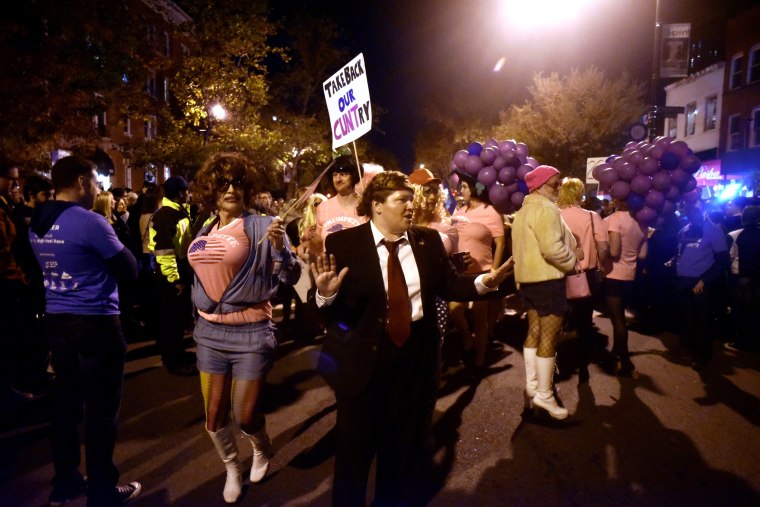 Image: Runners parade along 17th Street after the annual drag High Heel Race in Washington