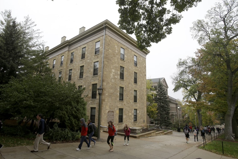 Students walk on the campus of the University of Wisconsin in Madison in 2013.