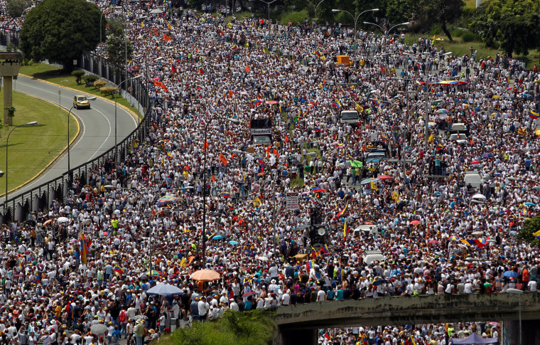 Image: Opposition supporters take part in a rally against Venezuela's President Nicolas Maduro's government in Caracas