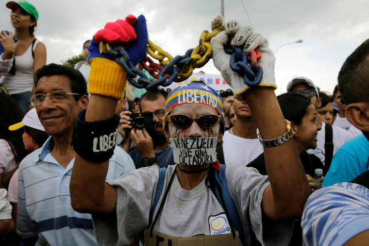Image: Opposition supporters take part in a rally against Venezuela's President Nicolas Maduro's government in Caracas