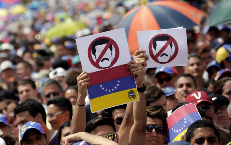 Image: Opposition supporters take part in a rally against Venezuela's President Nicolas Maduro's government in Caracas