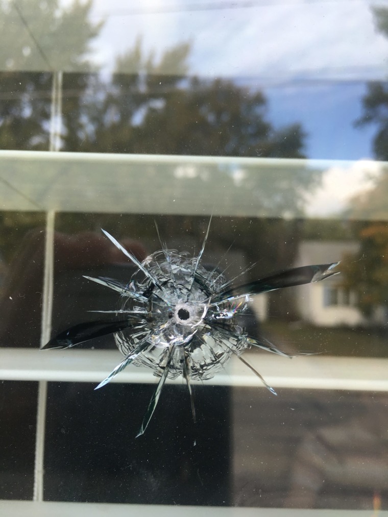 One of seven bullet holes that broke through a window on the north side of the house.