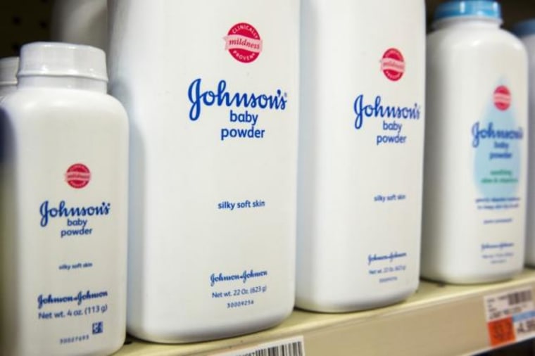 Bottles of Johnson &amp; Johnson baby powder line a drugstore shelf in New York