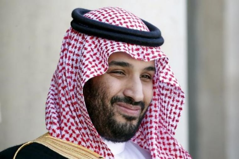 Saudi Arabia's Deputy Crown Prince Mohammed bin Salman reacts upon his arrival at the Elysee Palace in Paris