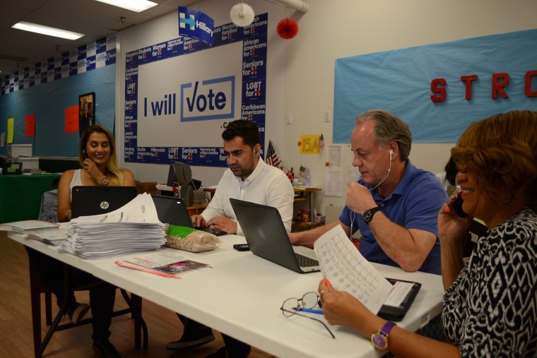 At a Clinton field office in Orlando, volunteers make calls urging voters to cast their ballots early.