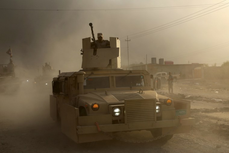 An Iraqi military humvee advances towards the city of Mosul, Iraq, Wednesday, Oct. 19, 2016.