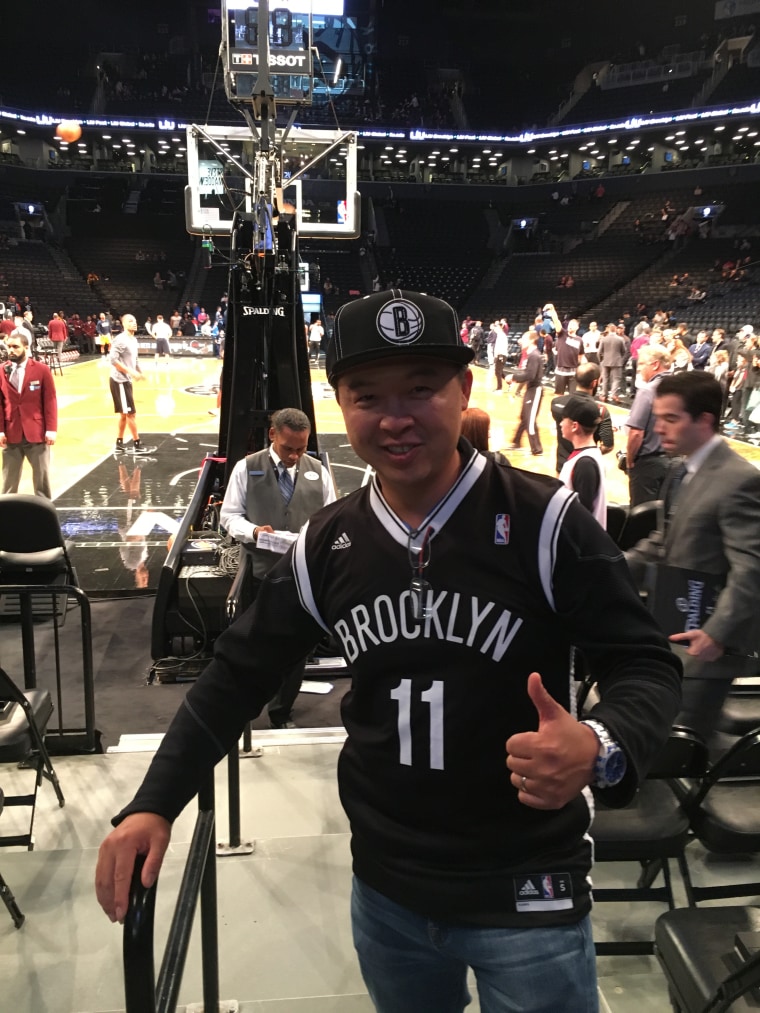 Mark Tsai, of Connecticut, and his 11-year-old son Colin attended the Brooklyn Nets' home season opener on Friday, October 28, 2016