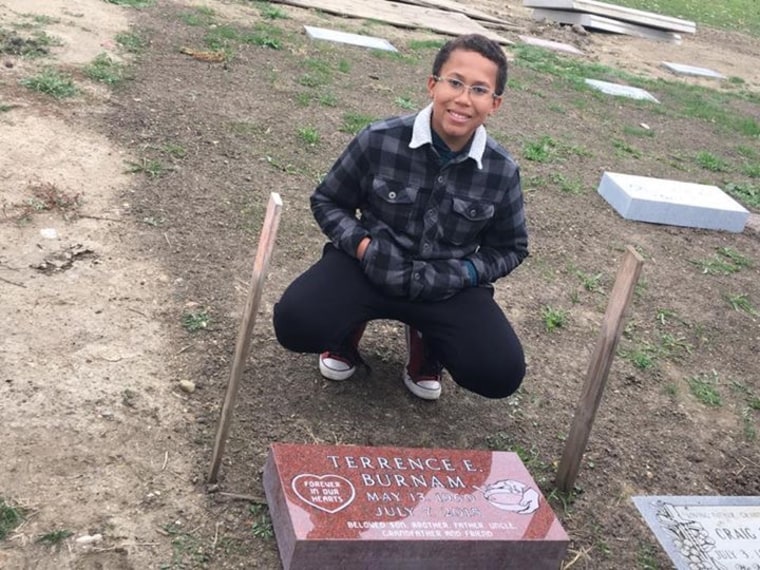 Boy mows lawns to buy dad's gravestone