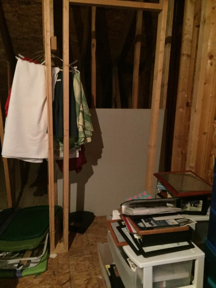 BEFORE: No walls? No problem! This family found clever ways to hang things up in their junk room.