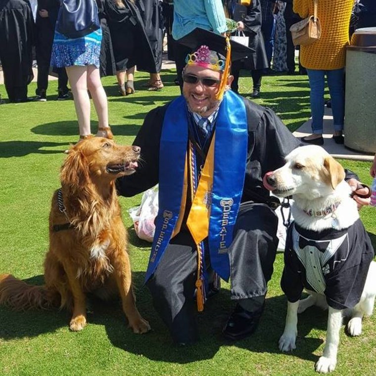 Randall Dexter with surf dog Ricochet and therapy dog Captain