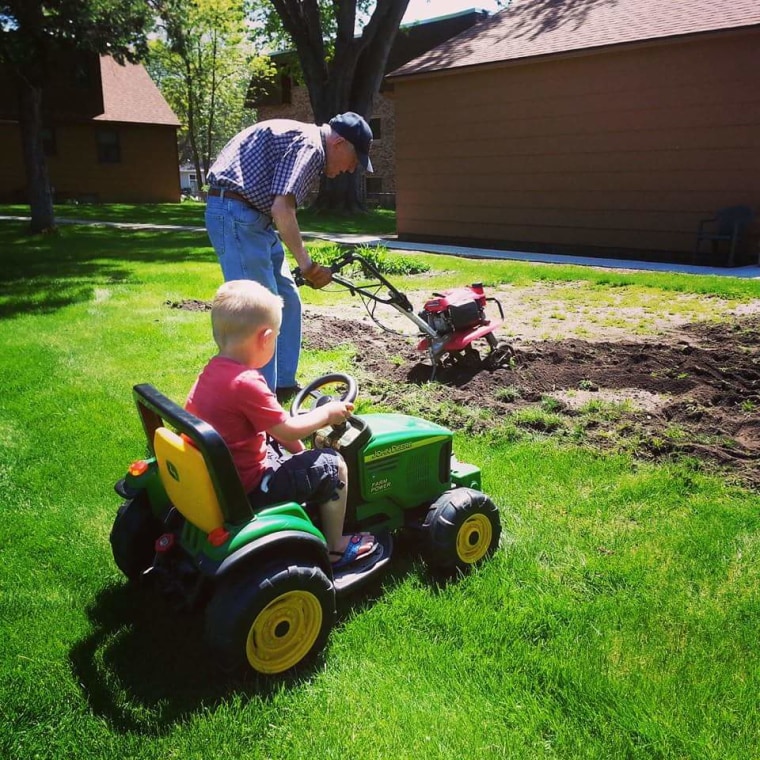 Emmett supervised as Erling attended his garden.