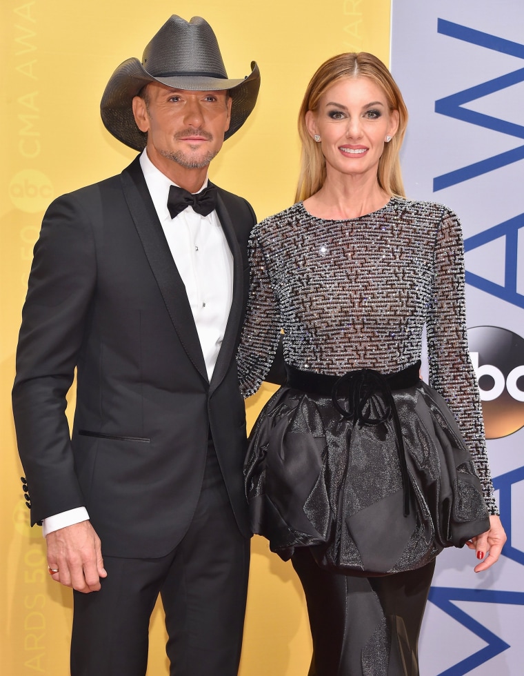 Country music singer Tim McGraw smiles for photographers with his mother  Betty Trimble during a ceremony to unveil his star on the Hollywood Walk of  Fame in Los Angeles, California on October