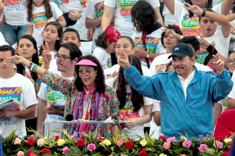Image: Nicaragua's President Daniel Ortega and  first lady  Rosario Murillo greets supporters during celebrations to mark the 37th anniversary of the Sandinista Revolution in Managua
