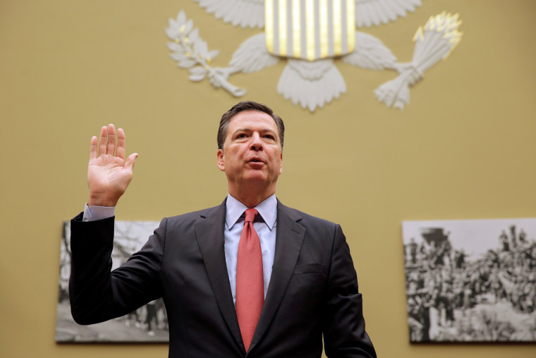 Image: FBI Director Comey is sworn in before testifying before a House Judiciary Committee hearing on \"Oversight of the Federal Bureau of Investigation\" on Capitol Hill in Washington