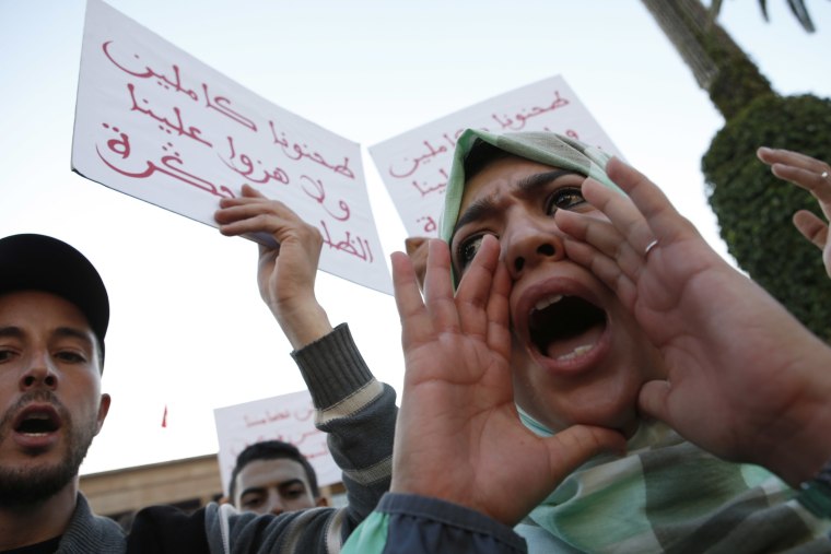 Image: A Moroccan shouts as thousands of Moroccans protest against the death of Mouhcine Fikri