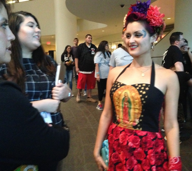 Denise Carlos, a member of the Latin band Las Cafeteras, speaks to fans after a Day of the Dead performance at the Smithsonian National Museum of the American Indian.