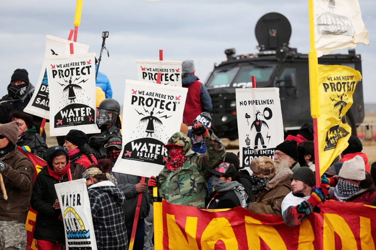 Image: Dakota Access Pipeline protesters square off against police