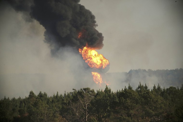 Image: Flames shoot into the sky from a gas line explosion in western Shelby County