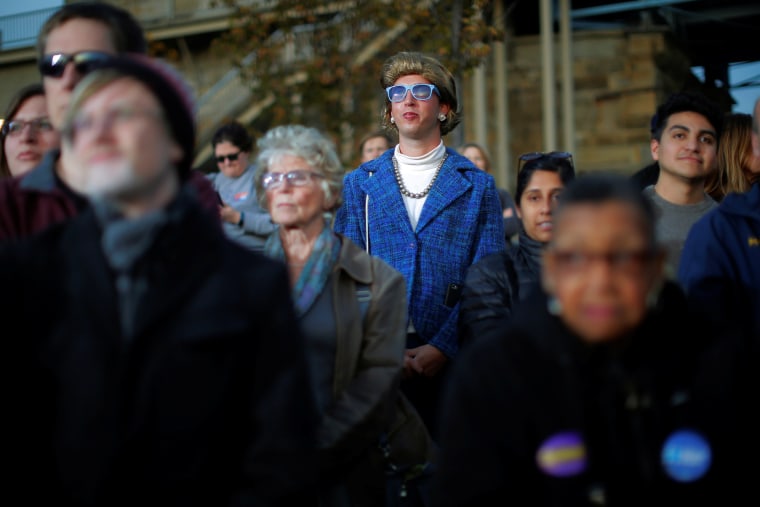 Image: A person dressed as U.S. Democratic presidential nominee Hillary Clinton stands in the crowd at a campaign rally in Cincinnati