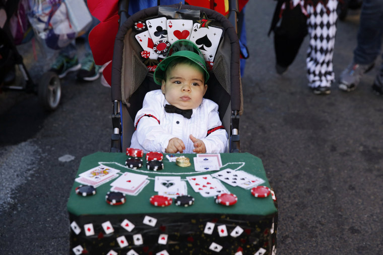 Image: A young child takes part in the Hoboken Ragamuffin Parade to celebrate Halloween in Hoboken, New Jersey