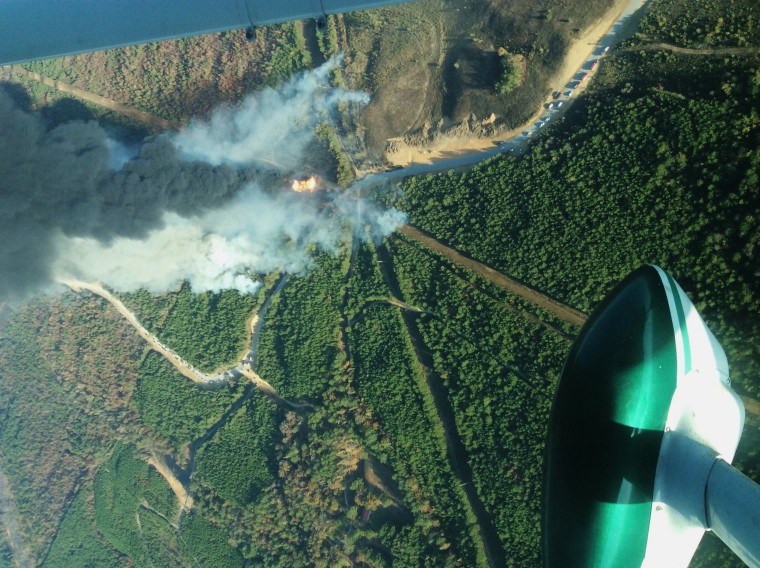 This photo provided by the Alabama Forestry Commission shows a fire caused by an explosion along the Colonial Pipeline in Shelby County, Ala., Monday, Oct. 31, 2016. Right now the two wildfires cause by the explosion have been contained at a total of 31 acres.