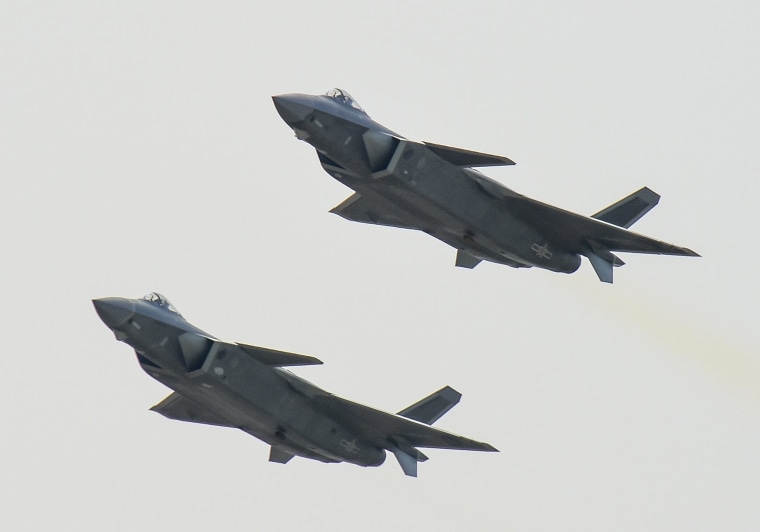 Image: J-20 stealth fighter jets fly in Zhuhai