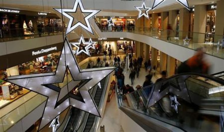 People walk through a shopping mall in the western Austrian city of Innsbruck