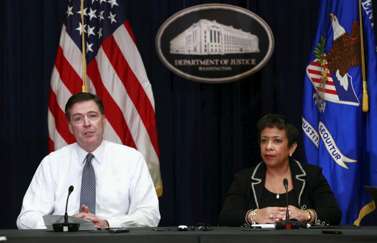 Lynch and Comey hold a media briefing at the Justice Department