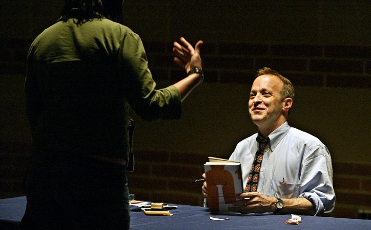 Humorist/writer David Sedaris interacting with fan during the signing of his new book "Dress our Fam