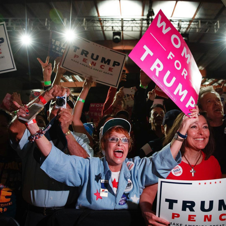 Image: Trump supporters listen as he speaks during a campaign rally in Albuquerque