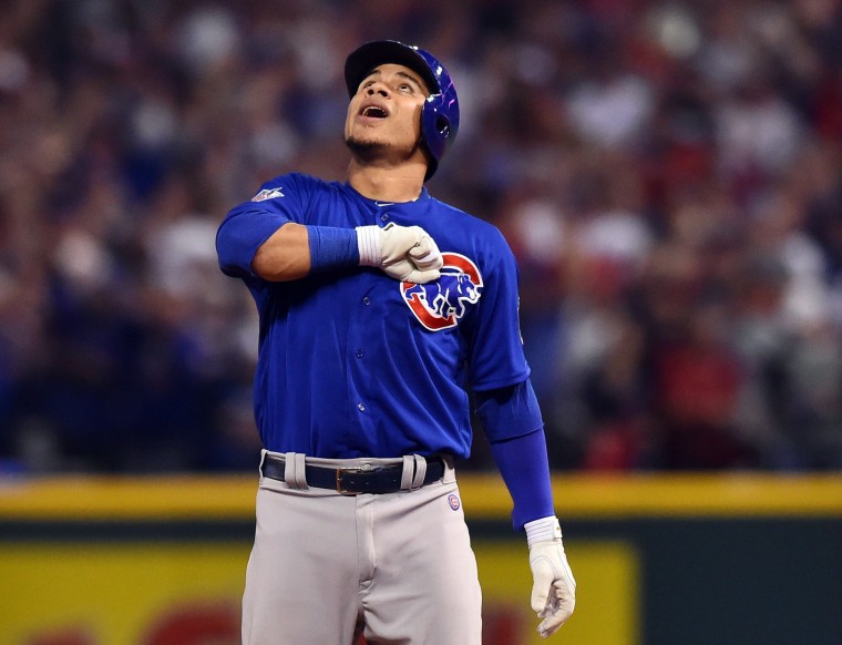 Cubs catcher Willson Contreras with the World Series trophy - ABC7 Chicago