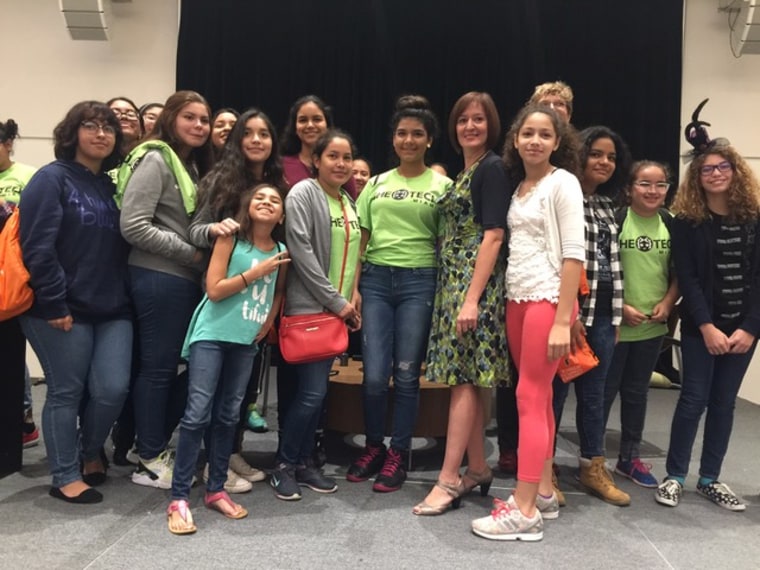 Dr. Alicia Abella with girls who wanted a picture with her. 
