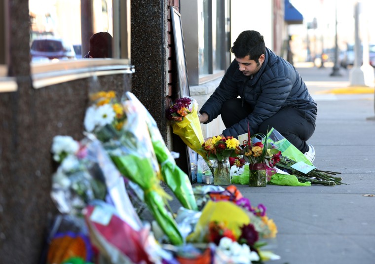 Image: Flowers were added to a memorial for Hussain Saeed Alnahdi