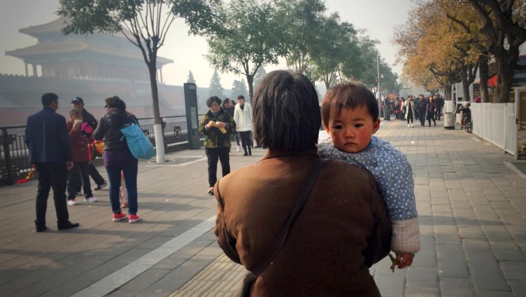 Image: A woman and baby in Bejing
