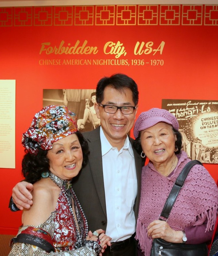 Filmmaker and author, Arthur Dong (center), with Chinese American nightclub dancers (l to r), Coby Yee and Dawn Leong, at the "Forbidden City, USA: Chinese American Nightclubs, 1936-1970 exhibition" at the San Francisco Public Library in 2014.