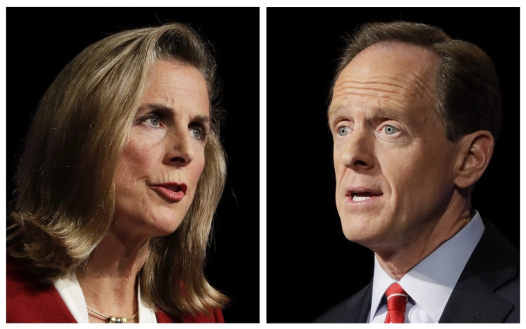 In this Monday, Oct. 24, 2016 combination of photos, Pennsylvania U.S. Senate candidates Democrat Katie McGinty, left, and Republican Sen. Pat Toomey take part in a debate at Temple University in Philadelphia.