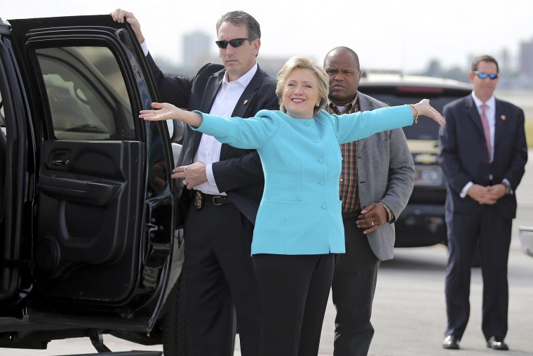 Image: U.S. Democratic presidential candidate Clinton reacts before boarding her campaign plane at Miami international airport in Miami