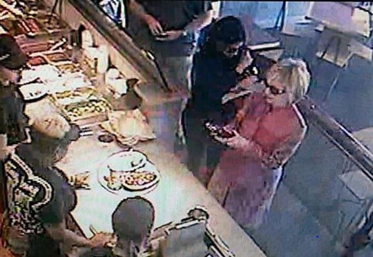 Former Secretary of State Hillary Clinton is seen in survelliance footage from a Chipotle restaurant.