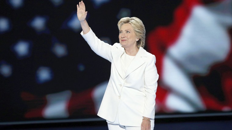Hillary Clinton waves as she arrives to accept the nomination on the fourth and final night at the Democratic National Convention in Philadelphia