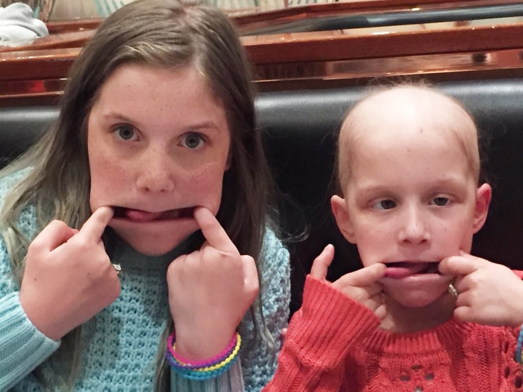 Dad takes a photo of his daughter, Hayley Brown's, last eyelash after cancer treatments.