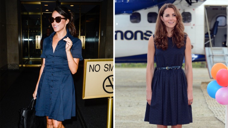 Both ladies are looking chic and poised in their navy dresses. 