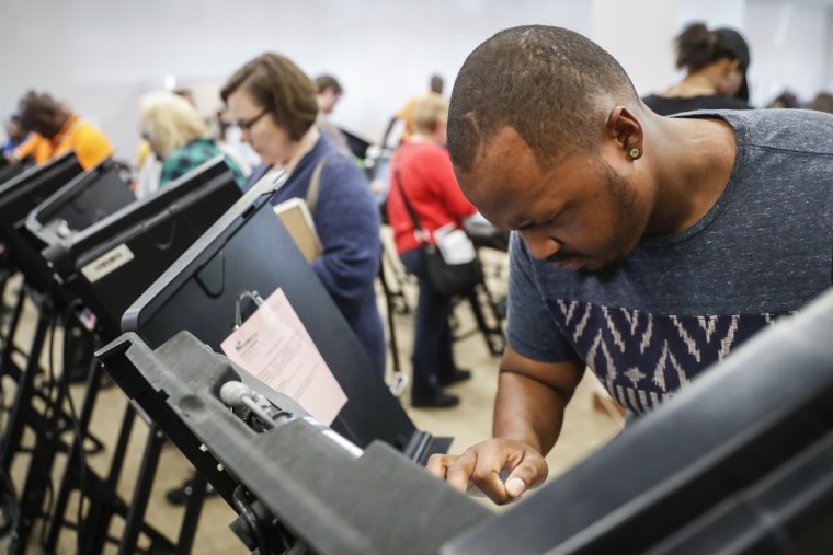 Image: Elijah Ransom of Columbus, Ohio, votes early at the Franklin County Board of Elections