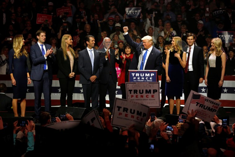 Image: Trump, Pence and their families rally with supporters at an arena in Manchester, New Hampshire