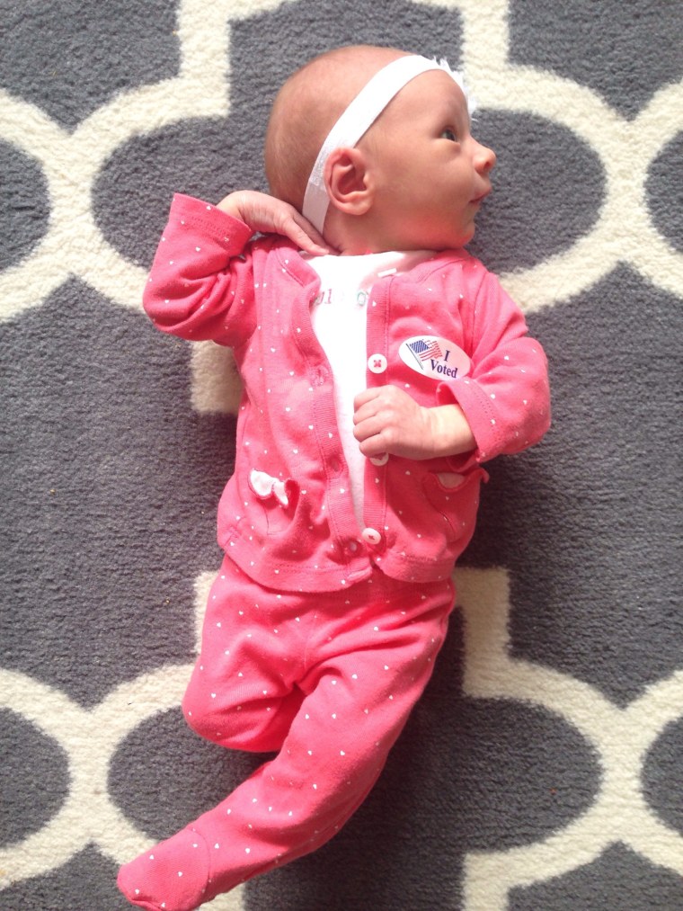 Newborn June Johnston, of New Market, Maryland, wears a "pantsuit" and an "I Voted" sticker.