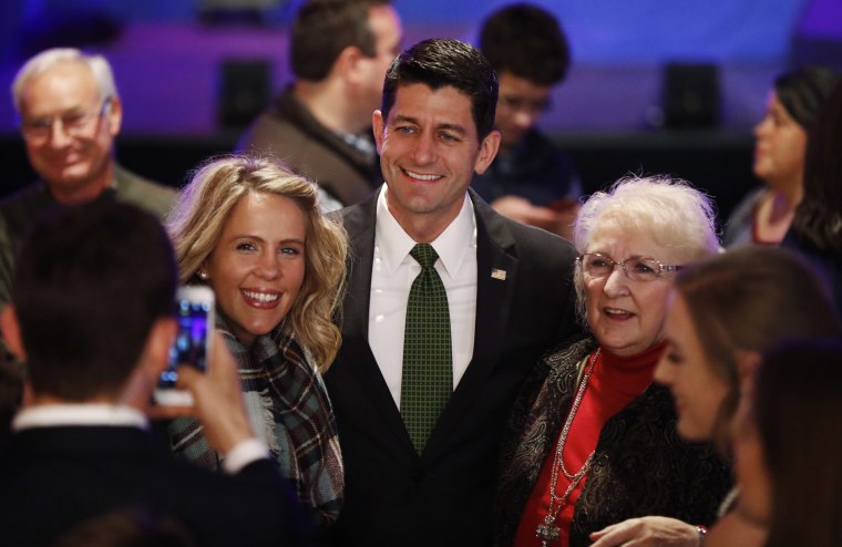 Image: Paul Ryan poses for photos with supporters at a campaign rally