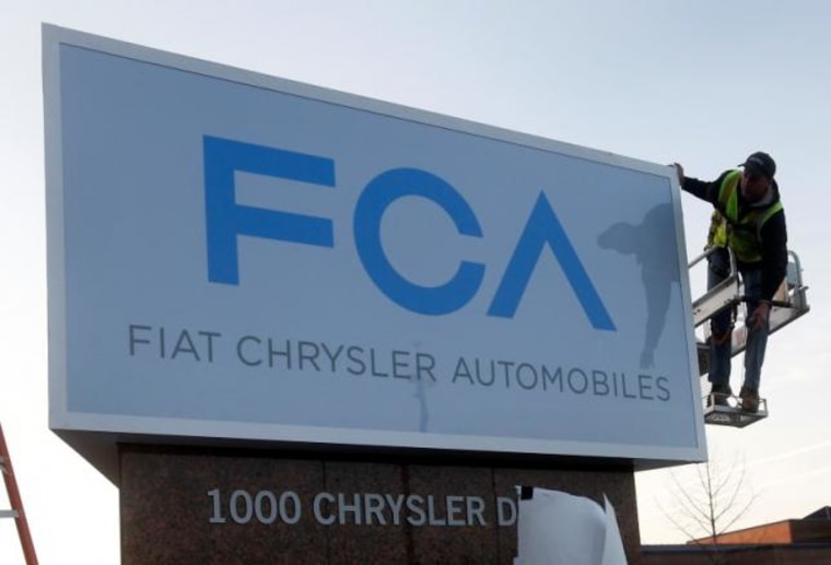 A new Fiat Chrysler Automobiles sign is unveiled at Chrysler Group World Headquarters in Auburn Hills, Michigan