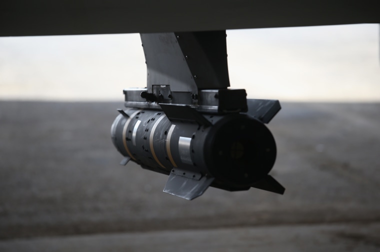 Image: A Hellfire missile hangs from a U.S. Air Force MQ-1B Predator