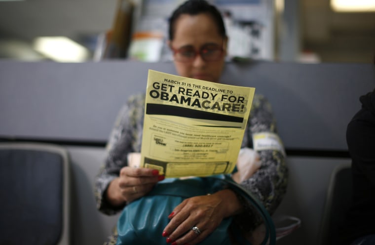 Image: File photo of Murillo reading a leaflet on Obamacare at a health insurance enrollment event in Cudahy, California