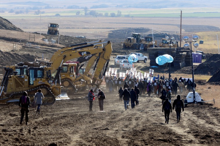 Image: Protesters march along the pipeline route during a protest against the Dakota Access pipeline near the Standing Rock Indian Reservation in St. Anthony, North Dakota